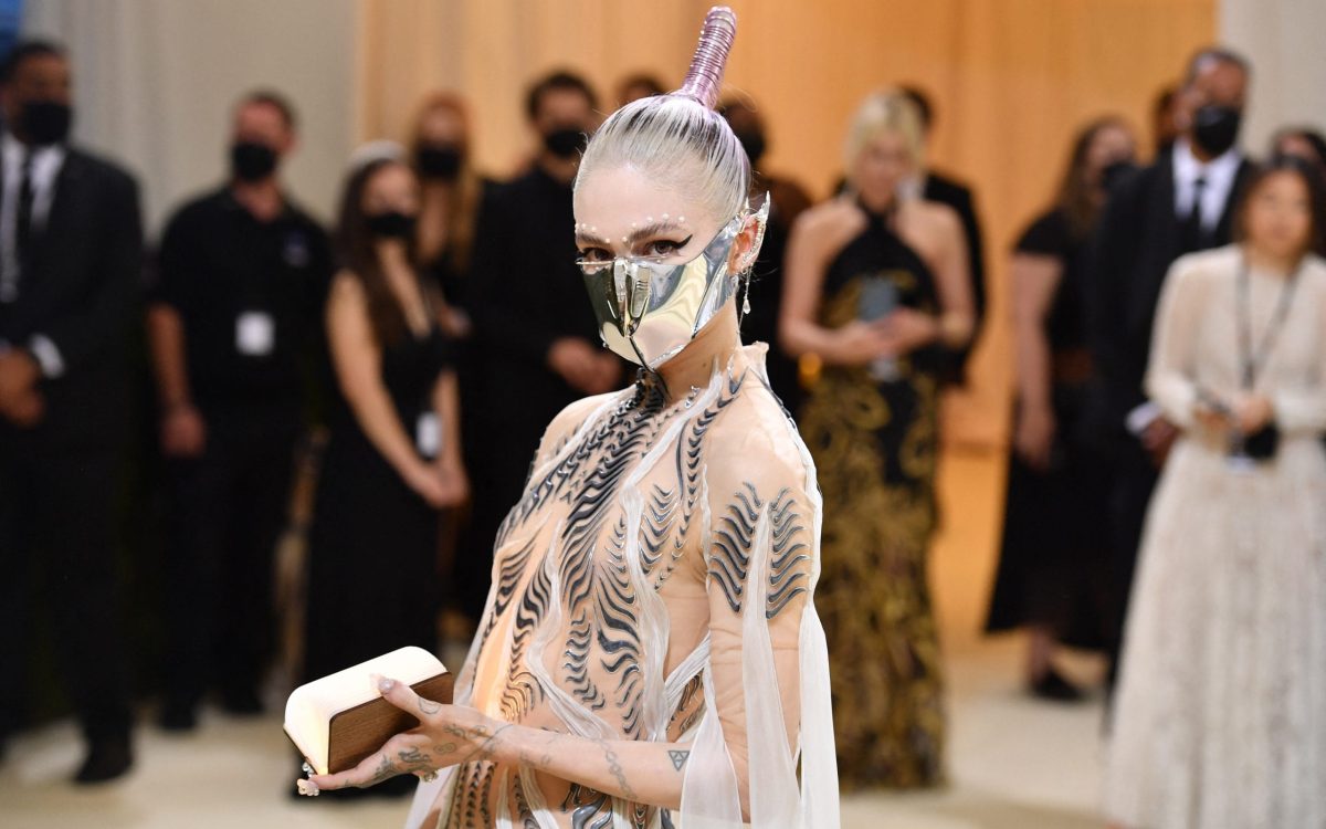 Canadian musician Grimes arrives for the 2021 Met Gala at the Metropolitan Museum of Art on September 13, 2021 in New York. - This year's Met Gala has a distinctively youthful imprint, hosted by singer Billie Eilish, actor Timothee Chalamet, poet Amanda Gorman and tennis star Naomi Osaka, none of them older than 25. The 2021 theme is "In America: A Lexicon of Fashion." (Photo by Angela WEISS / AFP)