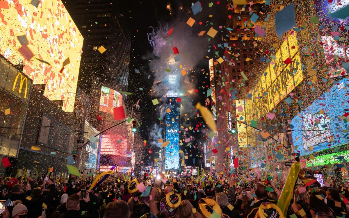 Confetti flies in the air at Times Square to mark the New Year in New York City on January 1, 2022. (Photo by Yuki IWAMURA / AFP)