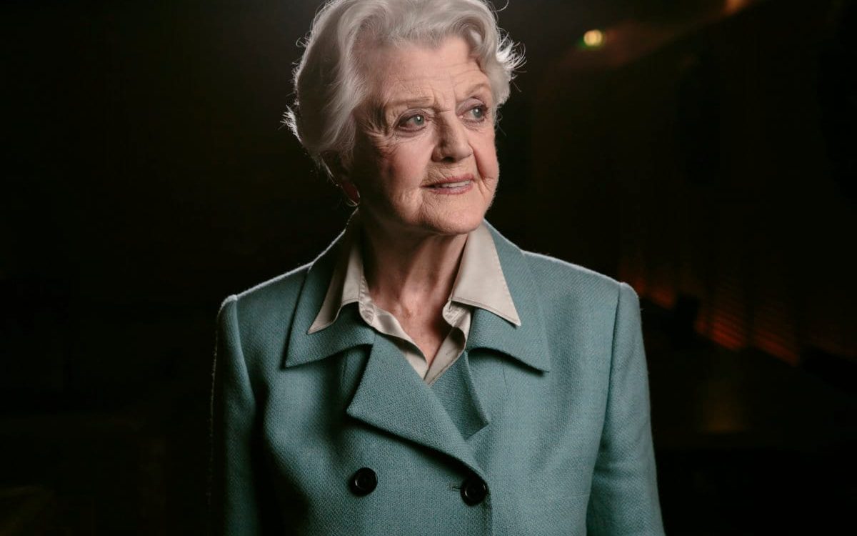 FILE - Angela Lansbury poses for a portrait during press day for "Blithe Spirit" in Los Angeles on Dec. 16, 2014. Lansbury, the big-eyed, scene-stealing British actress who kicked up her heels in the Broadway musicals “Mame” and “Gypsy” and solved endless murders as crime novelist Jessica Fletcher in the long-running TV series “Murder, She Wrote,” died peacefully at her home in Los Angeles on Tuesday. She was 96. (Photo by Casey Curry/Invision/AP, File)