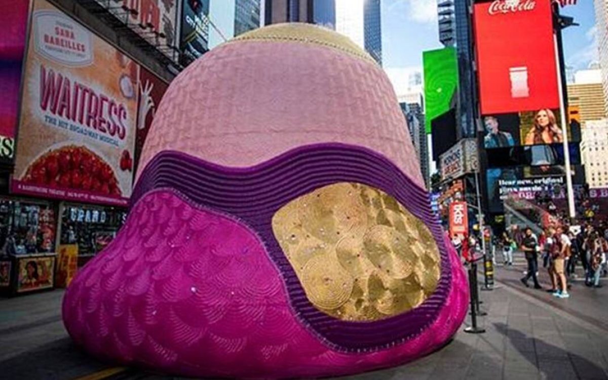 People visit the Fountain for Survivors, an immersive, 18-foot tall fountain covered in a mosaic of over 365,000 acrylic nails in Times Square in the Manhattan borough of New York, New York, U.S (REUTERS/Eduardo Munoz)