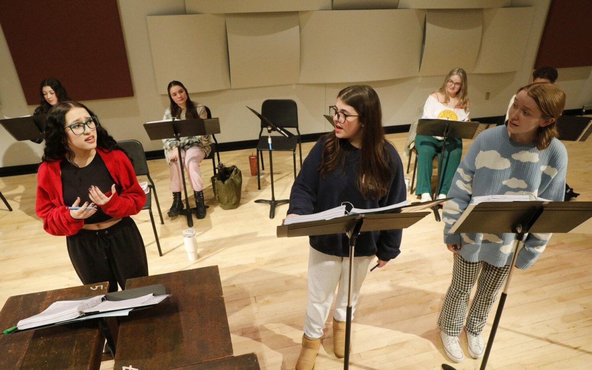 Photo provided by SUNY Cortland students rehearse in January for a staged reading of a new musical, In Emily’s Words, written by Jessy Tomsko and directed by Kevin Halpin, professor of performing arts. Olivia Celis, left, won Best Female Lead in  a Musical at the New Works Festival, one of several awards SUNY Cortland artists won.